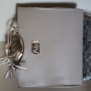 Gorgeous Taupe Bebe bag with golden color handle and accent. NWT